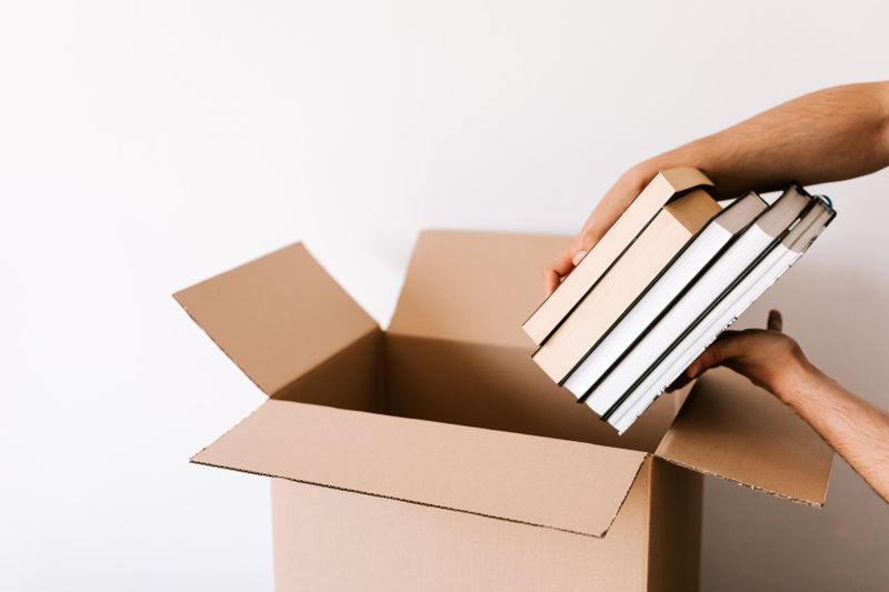 Personal belongings carefully packed into a moving box